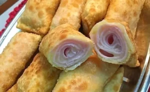 Rolinho de pastel com presunto e queijo